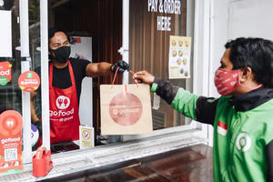 Gojek yêu cầu nhà hàng làm các suất ăn nhỏ hơn để chống chọi với giá cả leo thang 