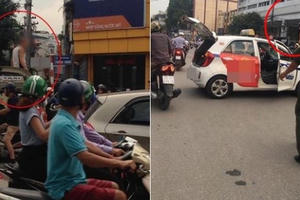 Hà Nội: Tài xế taxi "ăn vạ" trên nóc xe, xuất trình giấy bị phơi nhiễm HIV