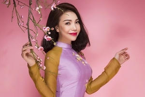 Trà Ngọc Hằng đẹp rực rỡ trong áo dài và bài hát mừng xuân mới