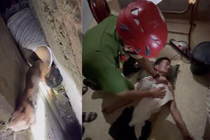 Giải cứu người đàn ông mắc kẹt giữa khe tường 2 nhà