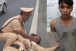 Khởi tố lái xe container hất văng CSGT xuống đường