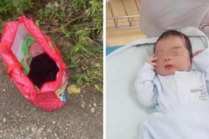 Bé trai nằm trong túi xách bị bỏ rơi bên đường