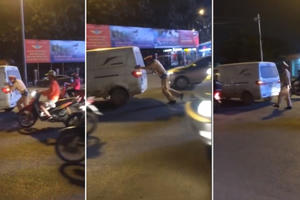 Cảnh sát giao thông còng lưng đẩy xe ô tô chết máy giữa đường