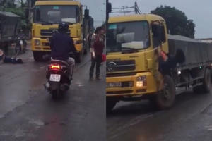 Hà Nội: Cô gái bất ngờ ra giữa đường chặn đầu xe tải rồi đánh đu lên gương xe khiến nhiều người hoảng hốt