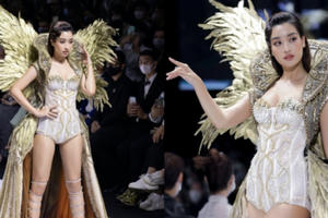 Đỗ Mỹ Linh diện váy 40kg, làm vedette show thời trang