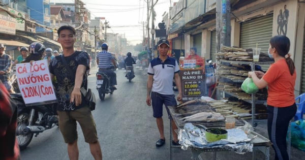 'Phố cá lóc nướng' Sài Gòn đông nghịt người ngày vía Thần tài