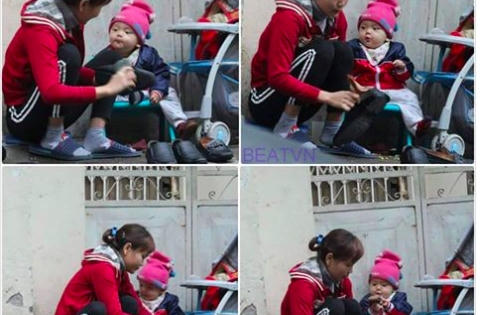 Ảnh hai mẹ con đánh giầy trên phố giáp Tết thu hút hàng ngàn lượt cảm xúc