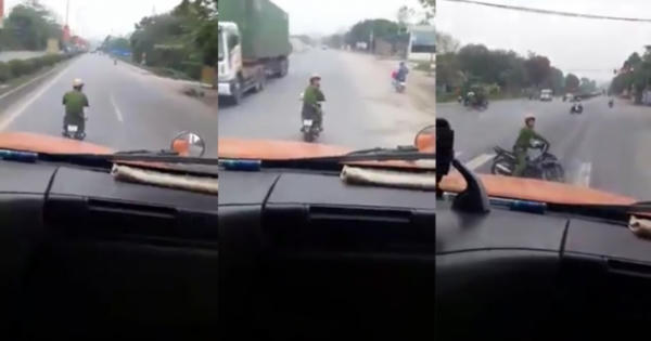 Độc giả Pháp luật Plus ngán ngẩm với hành động Thiếu úy Công an "đong đưa" trước đầu xe container
