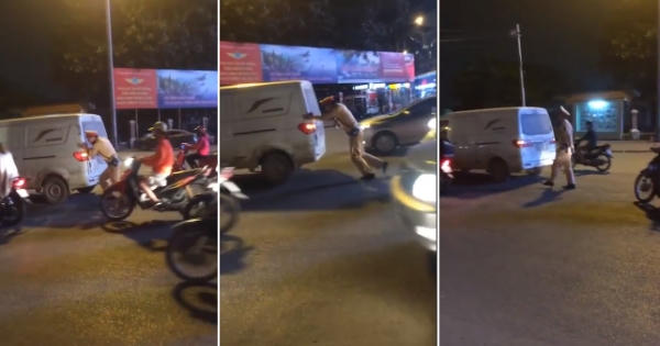 Cảnh sát giao thông còng lưng đẩy xe ô tô chết máy giữa đường Cảnh sát giao thông còng lưng đẩy xe ô tô chết máy giữa đường