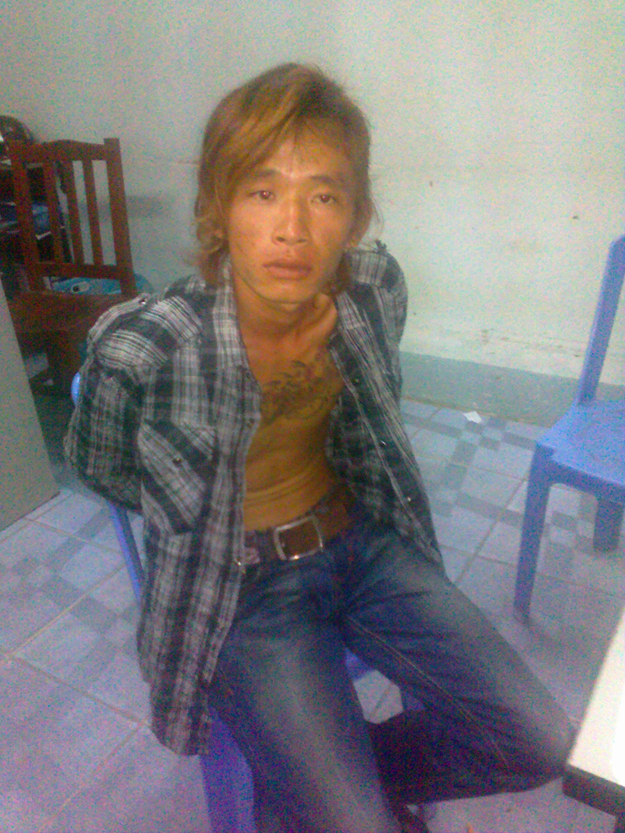 Tên Na tại cơ quan công an.