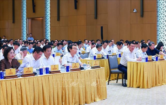 Các đại biểu dự Hội nghị toàn quốc sơ kết, đánh giá kết quả thực hiện việc tháo gỡ khó khăn, vướng mắc cho các dự án, đất đai. Ảnh: Dương Giang/TTXVN