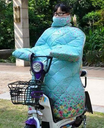 Người Hà Nội mặc “áo giáp” ra đường để chống rét