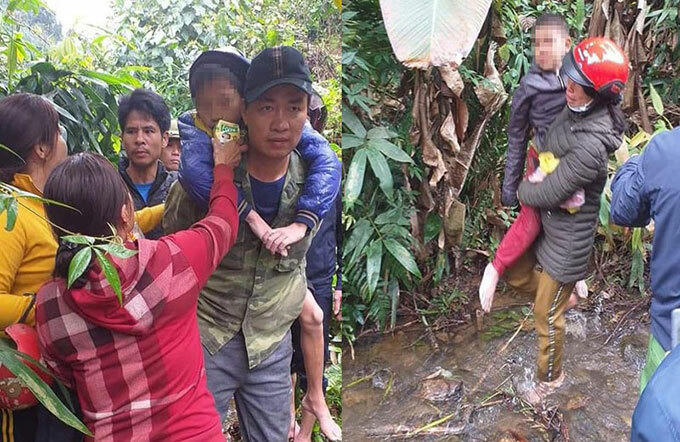 Người dân cõng hai bé trai ra khỏi bìa rừng. Ảnh: H.L