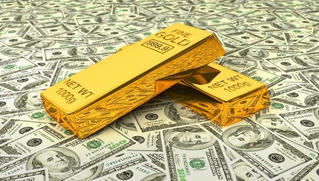 Giá vàng giảm nhẹ, USD tăng giá