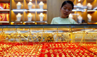 Giá vàng thế giới tụt xuống mức thấp nhất trong vòng 20 tháng qua