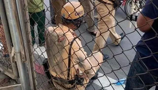 Phóng ô tô kéo lê trung úy cảnh sát trên đường Hà Nội