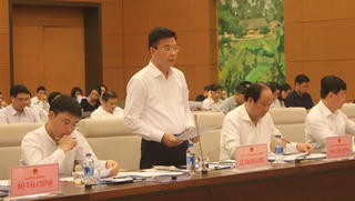 Bộ trưởng Lê Thành Long giải trình trước Ủy ban Pháp luật Quốc hội