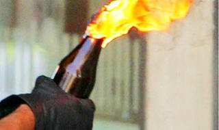 Bắt gã đàn ông chế bom xăng ném vào công ty trả thù cho vợ