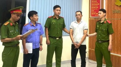 Bùi Thanh Khoa tại cơ quan công an