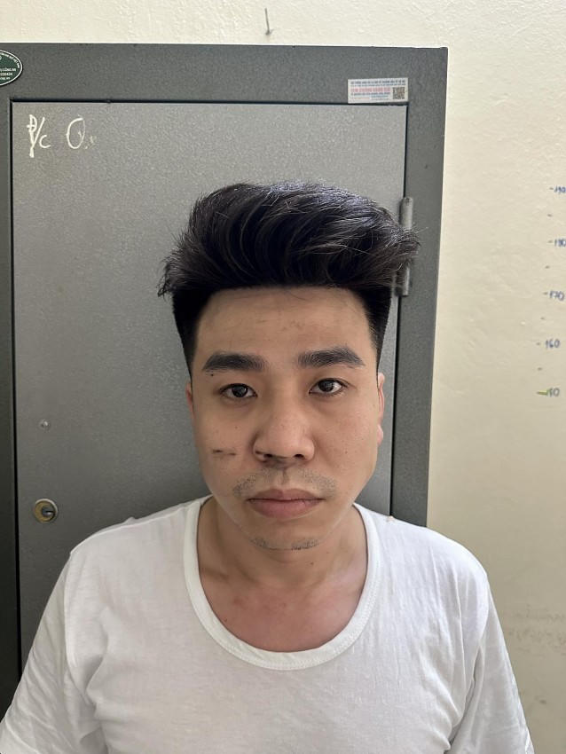 Lê Tuấn Đức tại cơ quan công an.