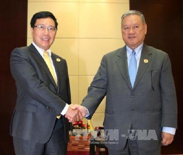 Phó Thủ tướng, Bộ trưởng Ngoại giao Phạm Bình Minh gặp Bộ trưởng Ngoại giao và Thương mại Brunei Lim Jock Seng. Ảnh: Phạm Kiên/Phóng viên TTXVN tại Lào.