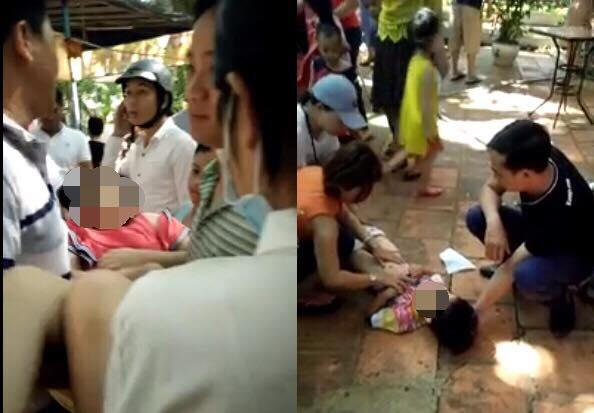 Hai cháu đang được mọi người sơ cứu.