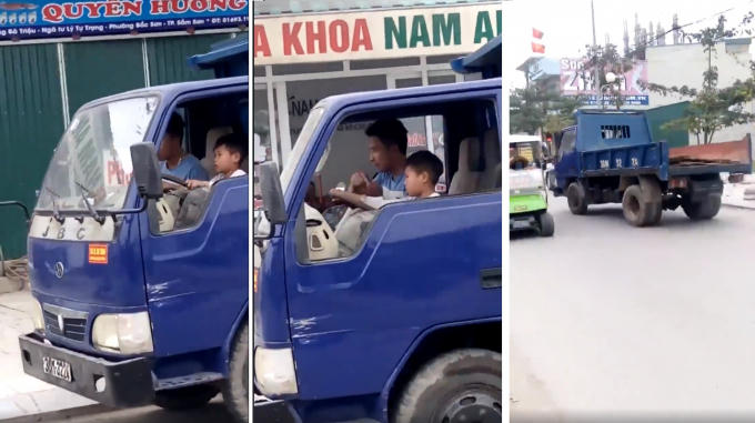 Bé trai điều khiển xe tải trên đường.