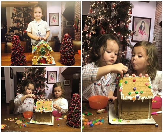 Hai baby nh&agrave; &ldquo;Chị Bống&rdquo; Hồng Nhung cẩn thận trang tr&iacute; ng&ocirc;i nh&agrave; nhỏ v&agrave; cẩn thận treo những quả cầu l&ecirc;n c&acirc;y th&ocirc;ng.