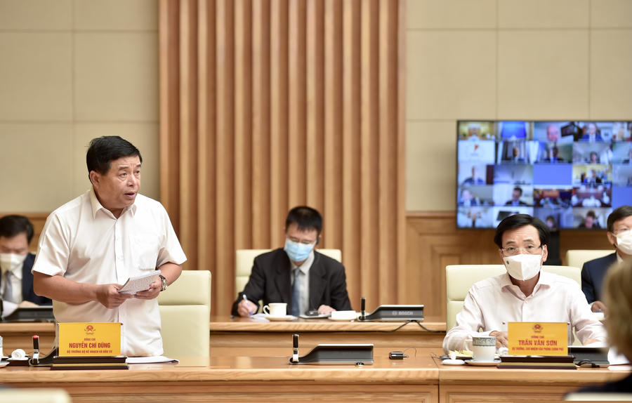 Bộ trưởng Bộ Kế hoạch và Đầu tư Nguyễn Chí Dũng giải đáp các kiến nghị, đề xuất của doanh nghiệp tại buổi tiếp - Ảnh: VGP/Nhật Bắc
