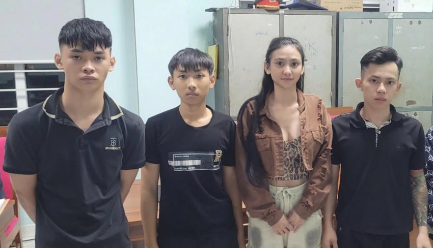 Phạm Thị Ngọc Trang cùng các đối tượng côn đồ.