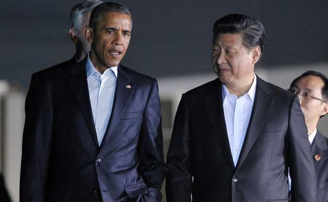 Tổng thống Mỹ Barack Obama (trái) và Chủ tịch Trung Quốc Tập Cận Bình. (Ảnh: AFP)