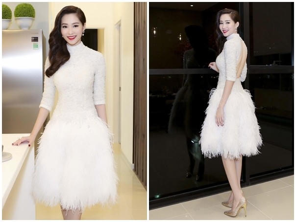 Dự sự kiện ra mắt dự án bất động sản, hoa hậu Đặng Thu Thảo chọn đầm trắng thanh lịch và nhã nhặn. Thiết kế được đính kết tinh xảo ở thân trên, lông vũ thanh thoát ở chân váy tôn hình ảnh sang trọng. Người đẹp gốc Bạc Liêu trang điểm thu hút và tóc suông nhẹ nhàng. Ảnh: Khoa Nguyễn