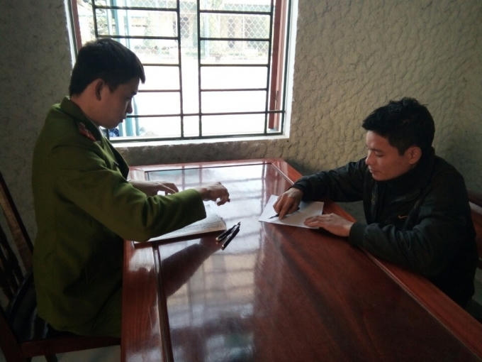 Đối tượng Quang tại cơ quan công an.