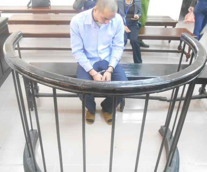 Bị cáo Lê Quang Vinh trước vành móng ngựa