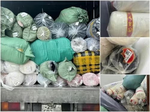 Thu giữ 50 cây vải may mặc không rõ nguồn gốc. (Ảnh: Công an TP Hà Nội)
