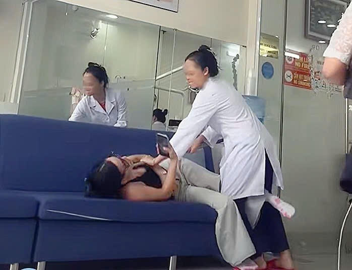Hình ảnh chị T bị hành hung (Ảnh: Cắt từ video).
