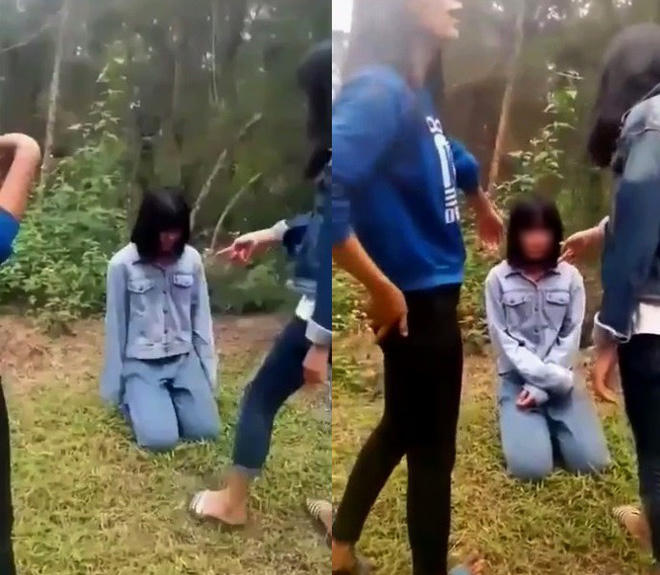 Th bị nhóm nữ sinh bắt quỳ, sau đó tát nhiều cái vào mặt (ảnh cắt từ clip).