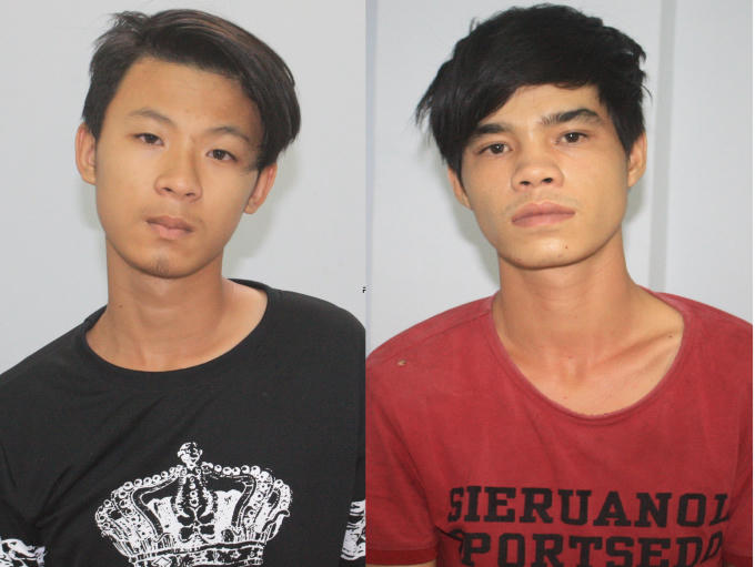 Hai đối tượng Văn Khang (áo đen) và Nguyễn Sỹ.