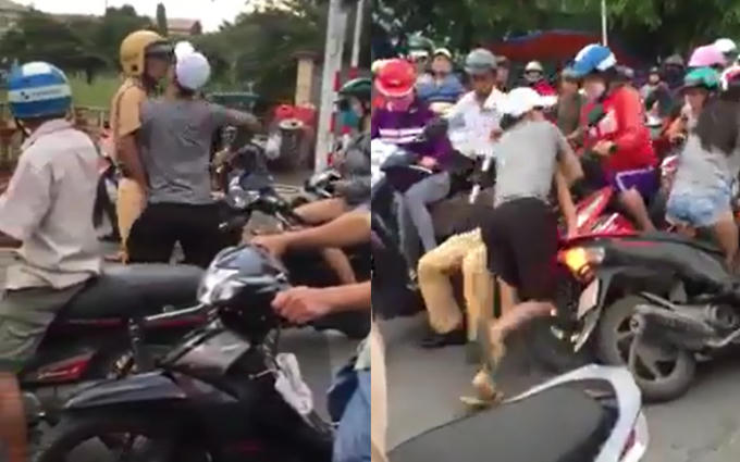 Nam thanh niên rút dao đe dọa đồng chí CSGT ở Nha Trang ( Ảnh: cắt từ clip)