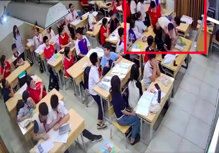 Học sinh lớp 7 ở Hà Nội túm tóc, ấn đầu cô giáo trong lớp. Ảnh: Cắt từ clip