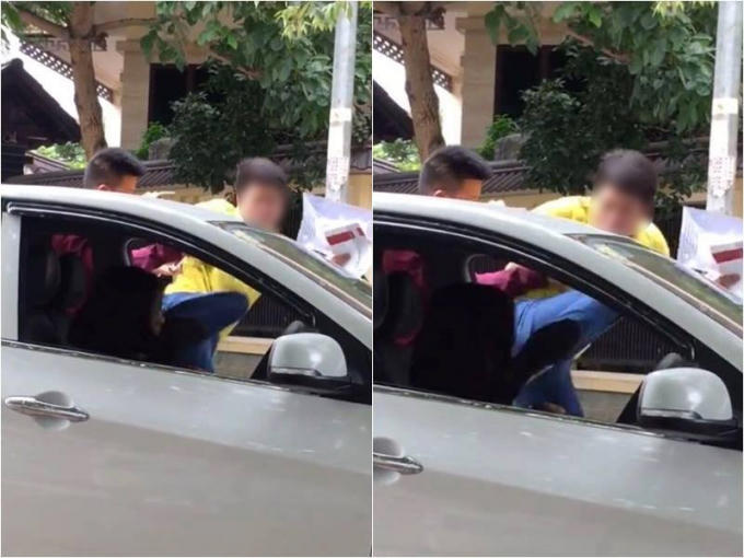 Nữ tài xế bị người đàn ông trung tuổi "tung chưởng" liên tiếp gây bức xúc cho những người chứng kiến sự việc. (Ảnh cắt từ clip).