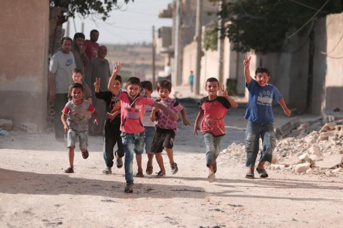 Trẻ em Manbij hạnh phúc khi thoát khỏi cảnh kìm kẹp và sợ hãi trước đây. (Ảnh: Reuters)