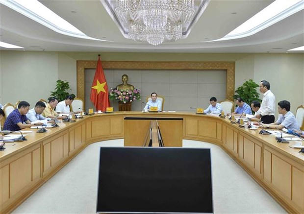 Phó Thủ tướng Trần Lưu Quang chủ trì cuộc họp với Ủy ban An toàn Giao thông Quốc gia. (Ảnh: Minh Đức/TTXVN)