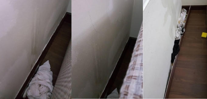 Tường nứt, nước thấm qua rò vào nhà khiến cư dân phải dùng chất liệu vải để thấm, ngăn nước. Ảnh: Cư dân cung cấp.