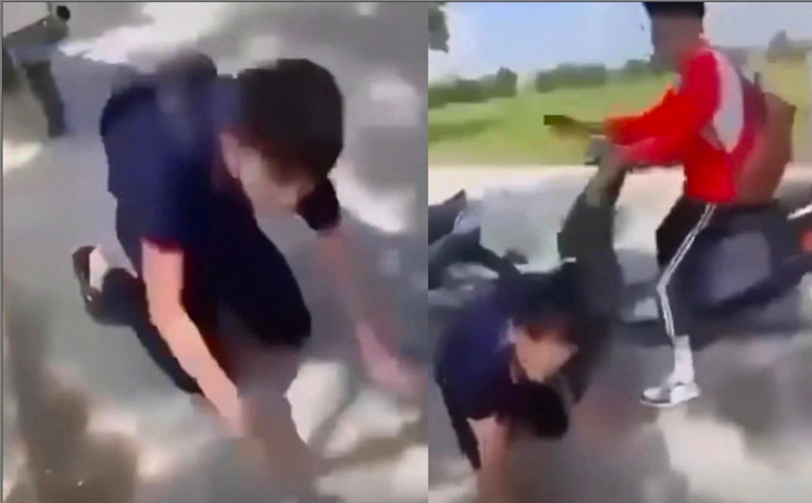 Nam sinh lớp 10 bị đánh, bắt quỳ, liếm biển số xe ở Sóc Sơn, Hà Nội. Ảnh: Chụp từ clip.