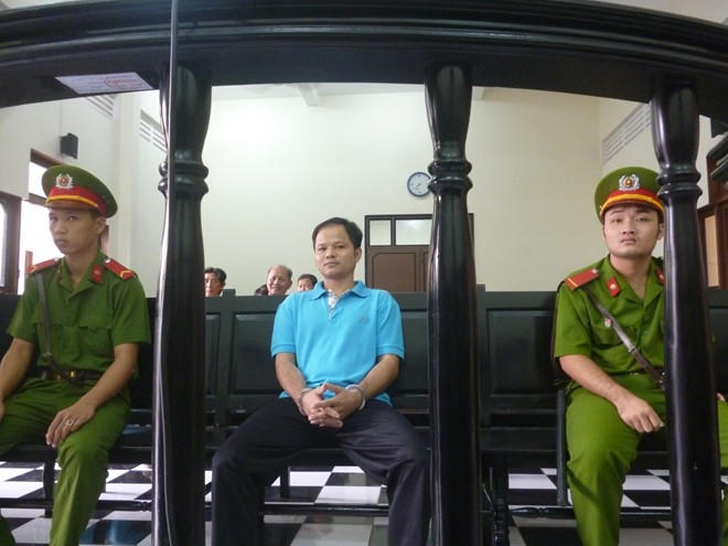 Bị cáo Minh tại phiên tòa sáng 17/12/2015 - TAND tỉnh Tiền Giang. Ảnh Thanh Huyền