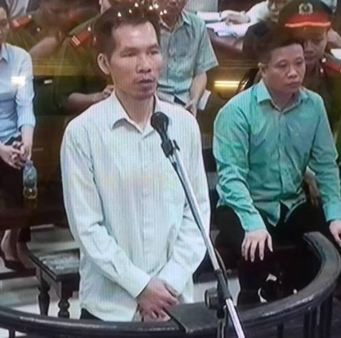 Bị cáo Hoàng Giang trước vành móng ngựa trong phiên tòa.