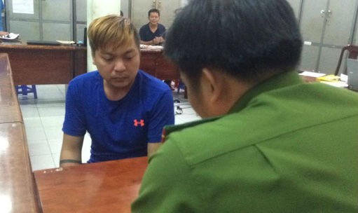 Nghi can Phúc tại cơ quan công an. Ảnh NLĐ