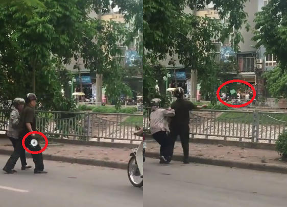 Hình ảnh người cán bộ tự quản đã ném cân của ngườ bán hàng rong. Ảnh: Cắt từ clip.