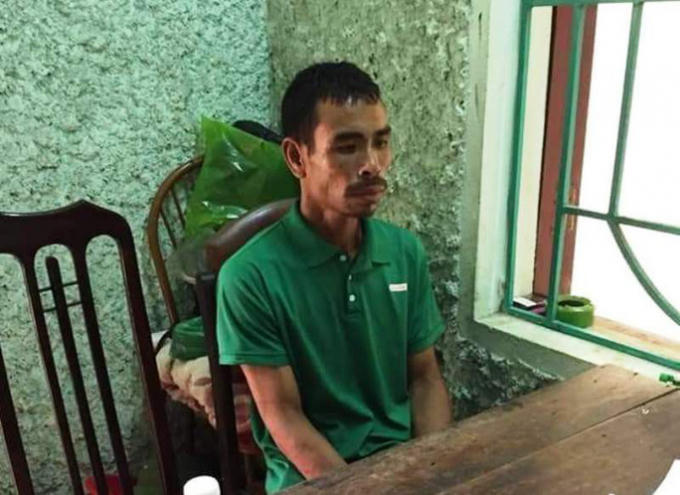 Nghi phạm Bùi Văn Tiển tại cơ quan công an sau 10 ngày cố thủ trên núi. Ảnh: NLĐ